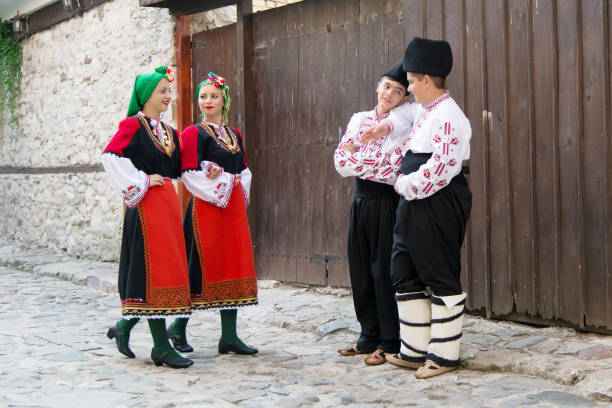 istock Folklore. Beautiful young people in folk costumes. 927374924