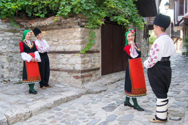 istock Folklore. Beautiful young people in folk costumes. 927377936
