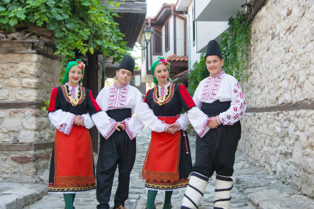 istock Folklore. Beautiful young people in folk costumes. 927378192