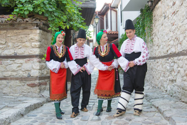 istock Folklore. Beautiful young people in folk costumes. 927378472