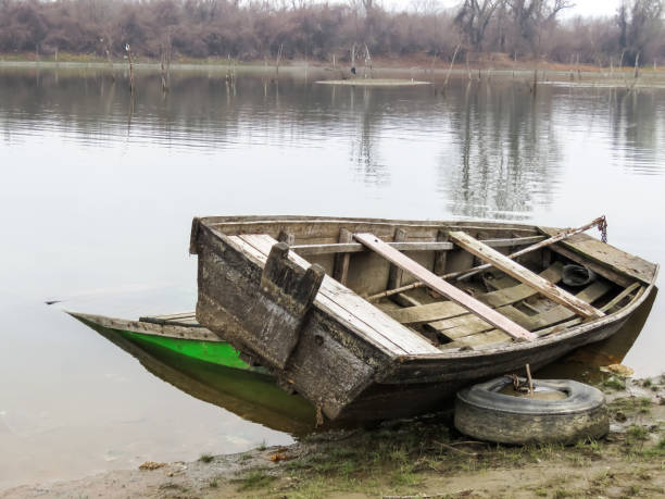 istock Old boat on the river bank, Serbia 927379174