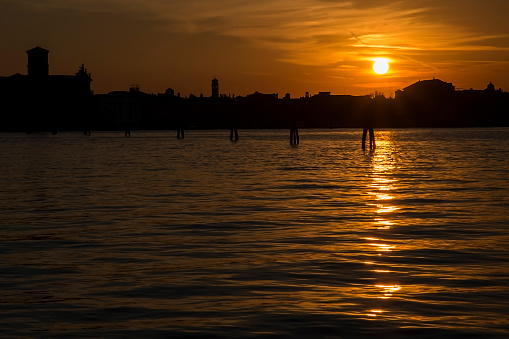the sun goes down over venice