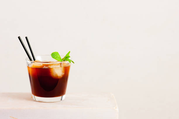 istock Glass of cold coffee or tea with ice cubes 927379872