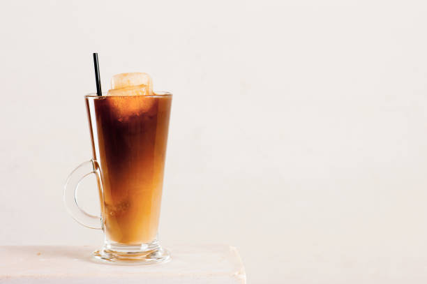 istock Glass of cold coffee or tea with milk 927379896