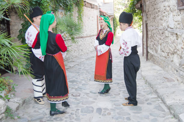 istock Folklore. Beautiful young people in folk costumes. 927383758