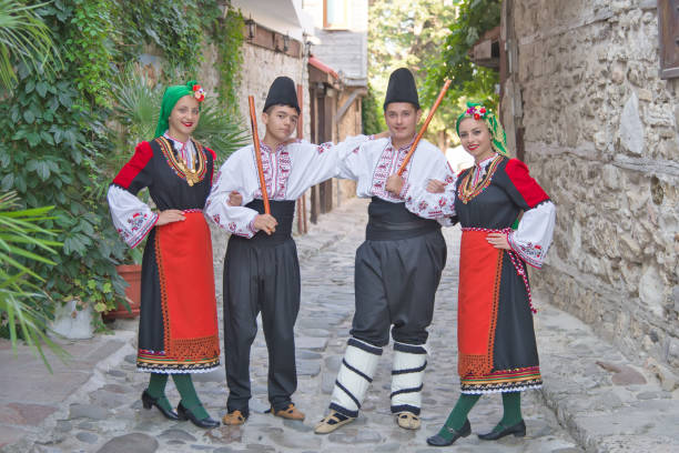 istock Folklore. Beautiful young people in folk costumes. 927385990