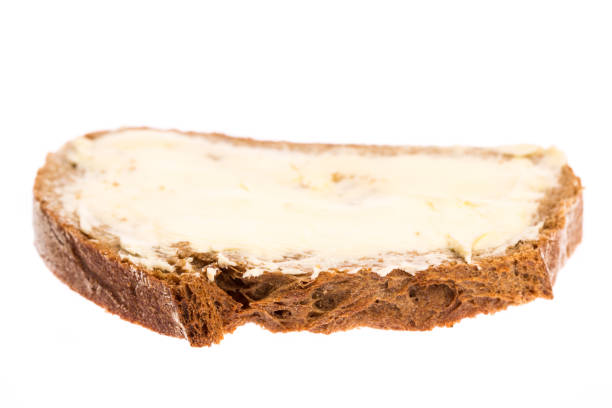istock Bread and butter isolated on white background 927386318