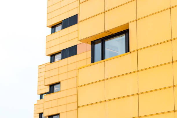 istock Facade of yellow colored building with black windows 927386964