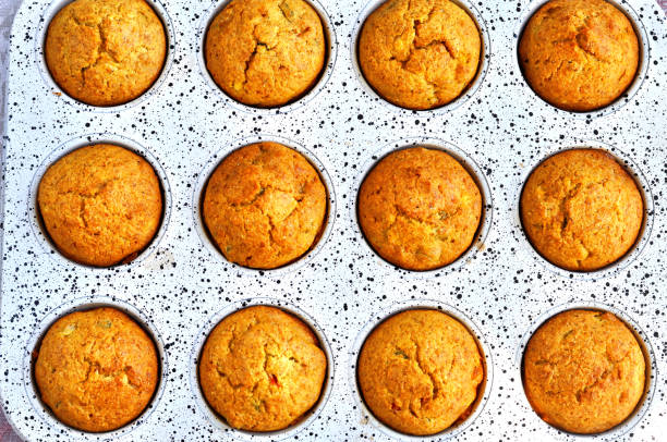 istock Delicious muffins in the pan for baking. Homemade bakery 927387206