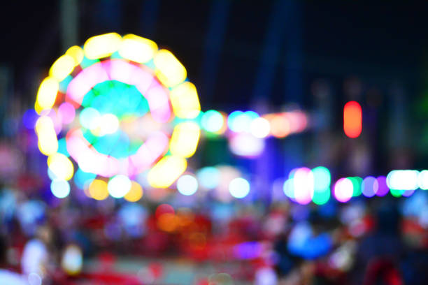 istock Ferris wheel light bokeh with dark background. 927387656