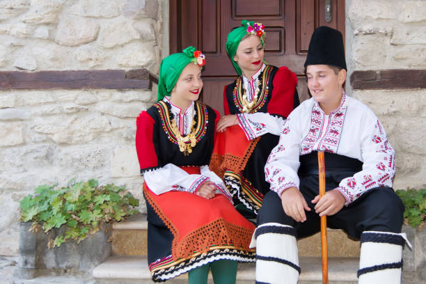istock Folklore. Beautiful young people in folk costumes. 927387732