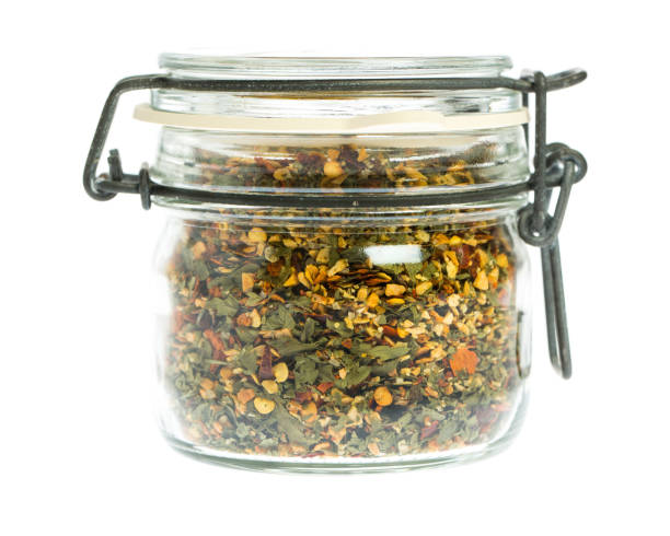 Spice mixture in glass isolated on white background