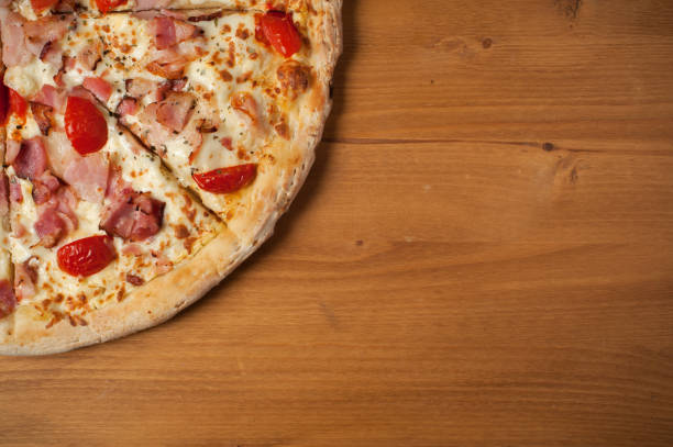 istock Fresh Italian pizza on wooden desk 927394350