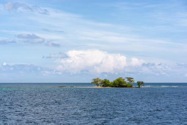 istock Small uninhabited island in ocean 927394586