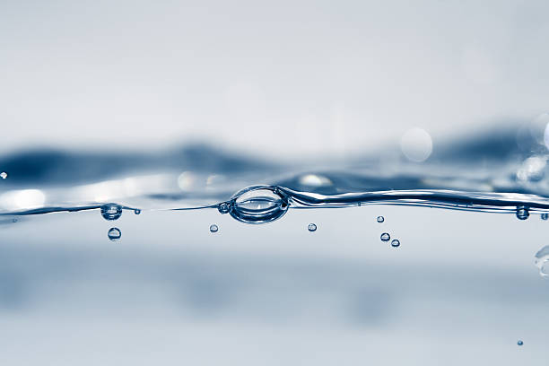 An image of blue water waves with bubbles