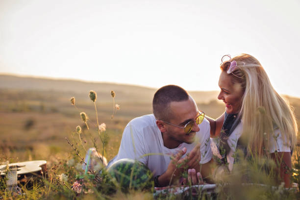 istock Beautiful young couple on picnic 927398550