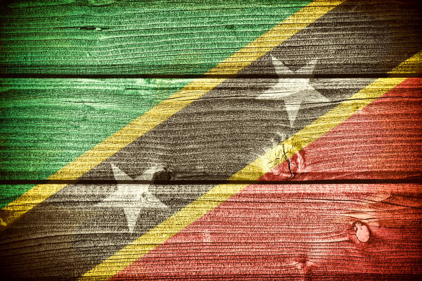 Flag of Saint Kitts and Nevis painted on old grungy wooden  background