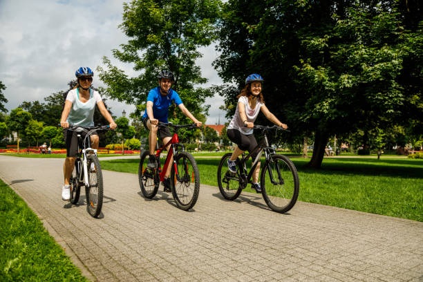 istock Urban biking- three people riding bikes in city 927401598