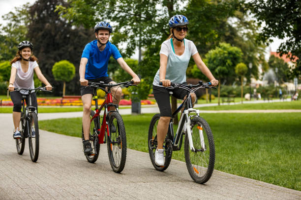 istock Urban biking- three people riding bikes in city 927401814