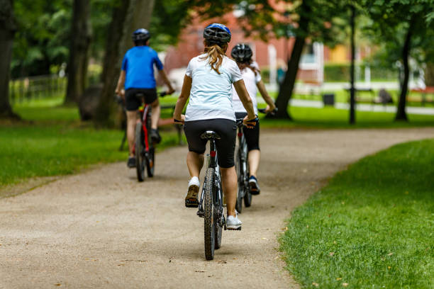 istock Urban biking- three people riding bikes in city 927401896