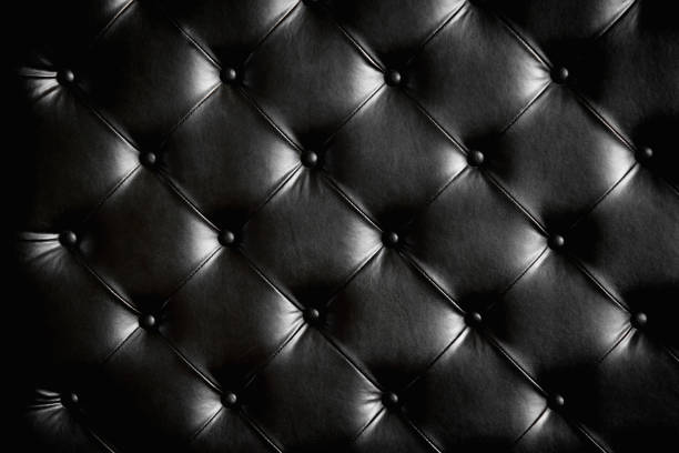 istock Luxurious black leather texture furniture with buttons 927402378