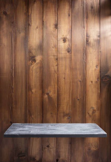 istock shelf at wooden background 927402694