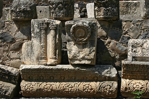 The Temple of Apollo is a Roman temple built around 150 A.D. during the Pax Romana era in the ancient Carian town of Side, in southern Turkey on the Mediterranean Sea coast and dedicated to Apollo, the Greek and Roman god of music, harmony and lightAn impressive artifact of Roman architecture, this image showcases three delicately crafted ancient columns from an archaeological site in Turkey, symbolizing history, culture, and artistic triumphs over time.