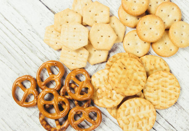 istock Mix of snacks : pretzels, crackers, cookies. 927405600