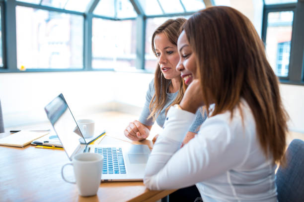 istock Businesswomen using laptop in the office 927406286