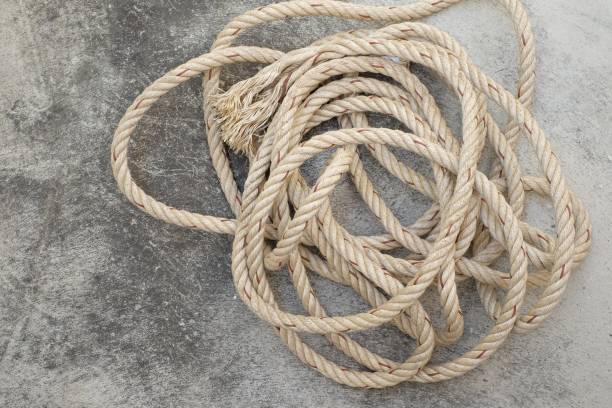 istock pile of rope on cement floor 927406420