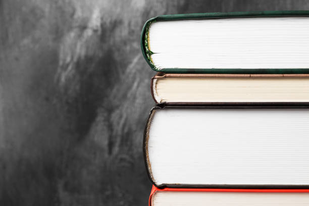 istock Pile of various books on dark background. Copy space 927406666