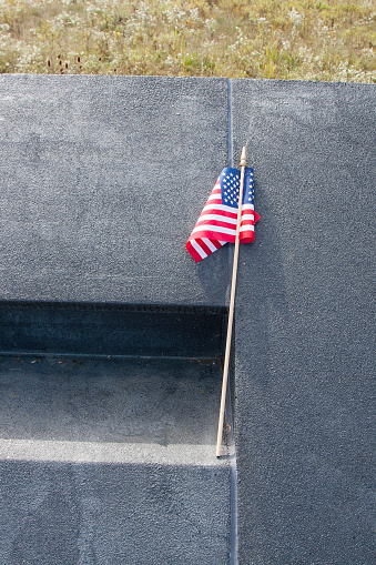 Flag against wall of Flight 93 National Memorial in Pennsylvania.
