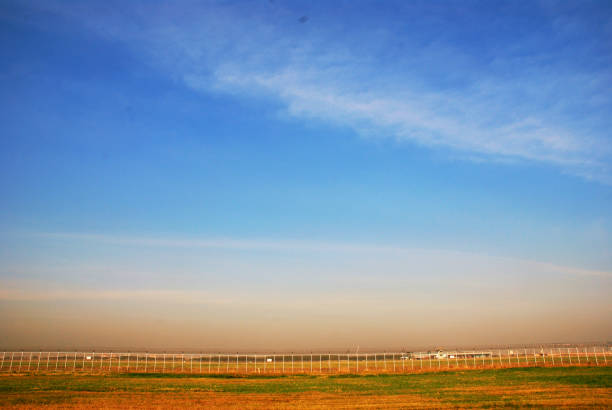 istock Field and landscape on clear sky background. 927408144