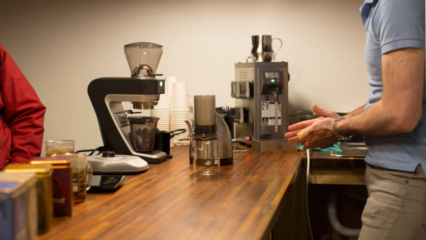istock A Small Business Owner is Serving a Customer. 927410582