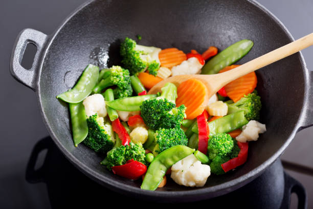 istock stir fried vegetables in a wok 927414870