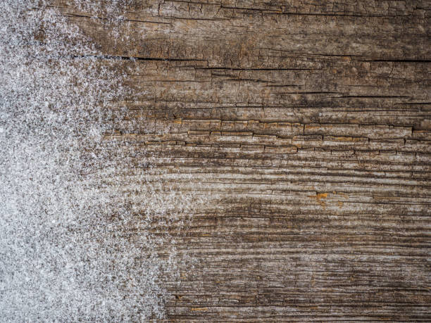 istock background. snowflakes on an old wooden Board 927415434