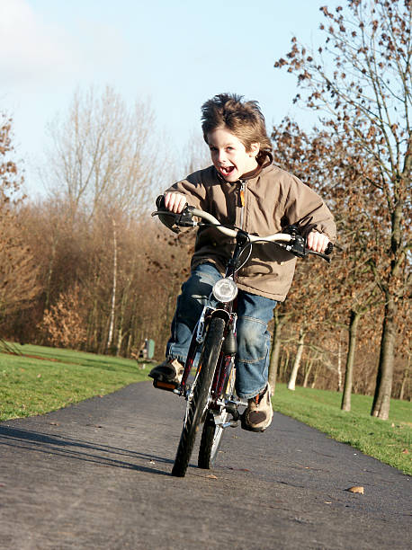 My son riding his bike on a sunny winter day...