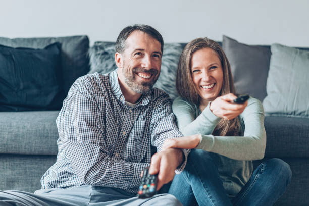 istock Family fighting for TV channels 927421854