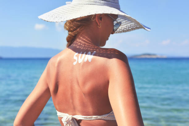 istock SUN written with Sun Cream on a Woman's Shoulder 927422950