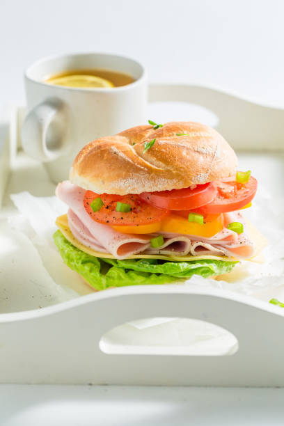 istock Delicious sandwich with fresh ingredients and tea 927423562