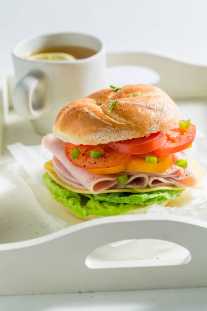istock Delicious sandwich with ham, cheese and tomatoes 927423612
