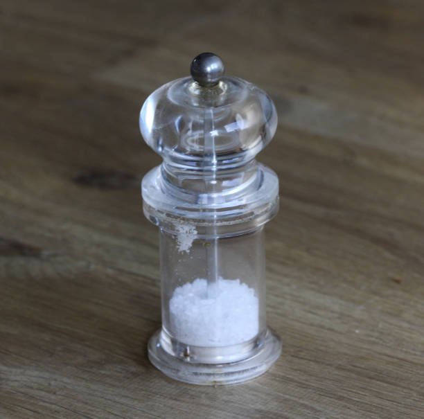 istock glass salt mill set on wooden background 927426502