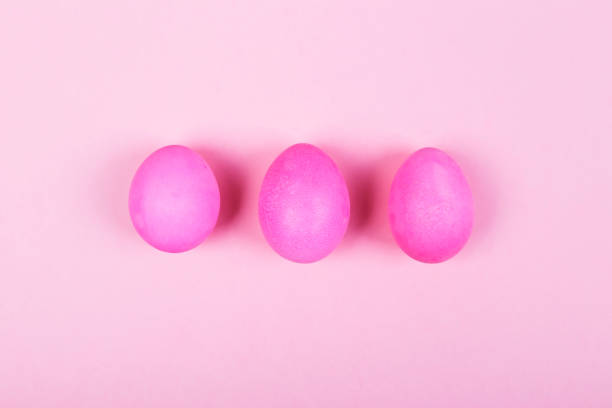 istock Pink eggs on pink background. Top view 927427508