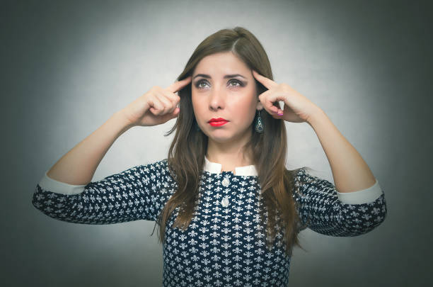 istock Pensive thinking girl. Wistful woman. Headache. 927427562