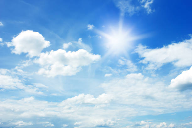 istock sun and clouds in the blue sky background 927427634