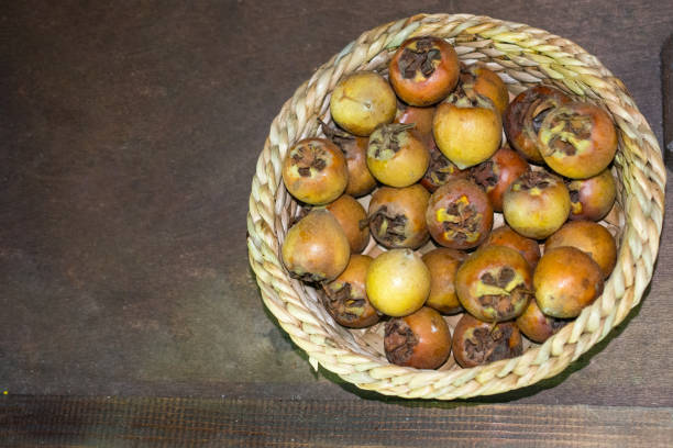 istock Freshly picked up medlar fruit species mespilus germanica in box 927433670