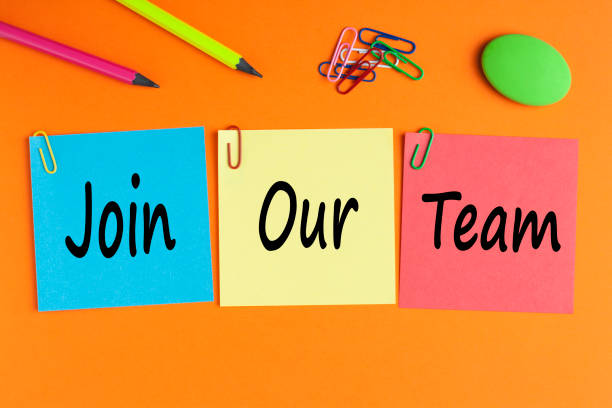 Join Our Team Concept Join our team written on color notes and office supplies. Business Concept. Top view. help wanted sign photos stock pictures, royalty-free photos & images