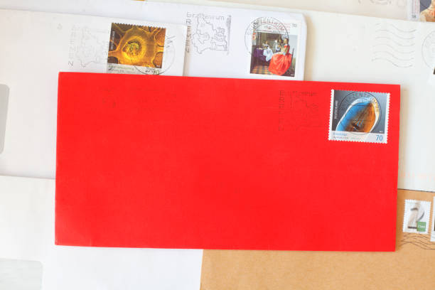 istock Red envelope with stamped German stamp 927443684