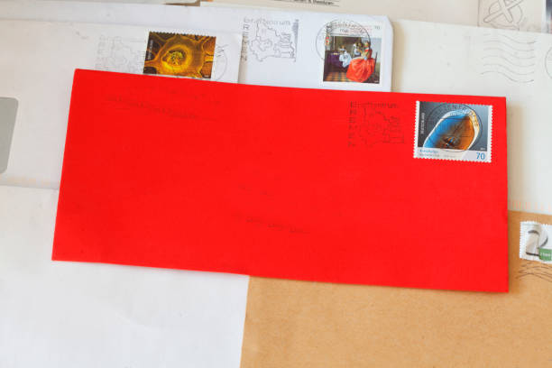istock Red envelope with stamped German stamp 927443818