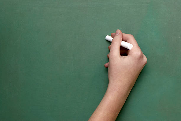 istock Man holds a piece of chalk 92744562